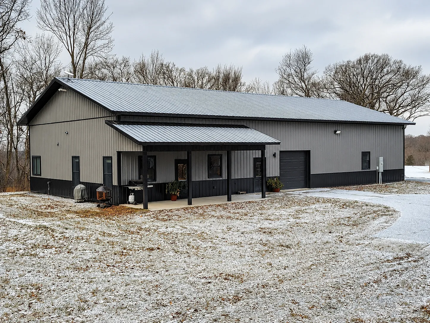 Gray post-frame shop in winter